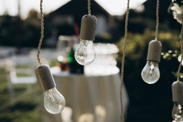 istock wedding decor, decoration of the arch of the exit ceremony with light bulbs. selective focus, film and grain photo 1187608397