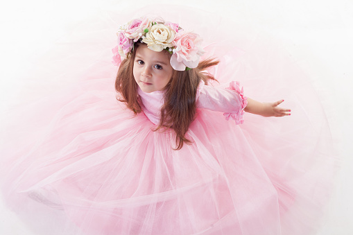 Little princess girl in pink crown