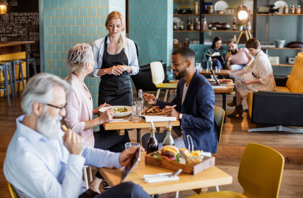 istock Business People on a Lunch Break at a Cafeteria 1187610294