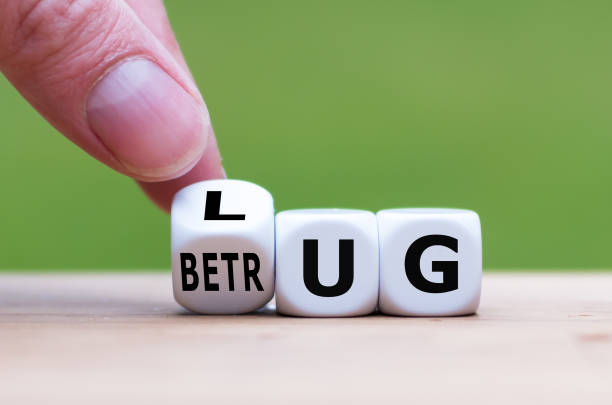 istock Hand turns a dice and changes the German word 