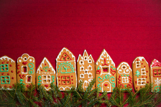 istock Red table cloth with town of cute gingerbread 1187613904