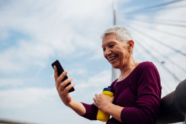 istock Older woman taking a selfie after workout 1187614020