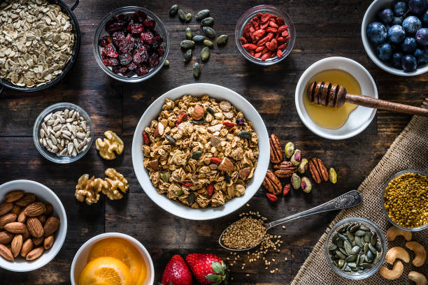 Healthy eating: homemade granola preparation ingredients. Top view.