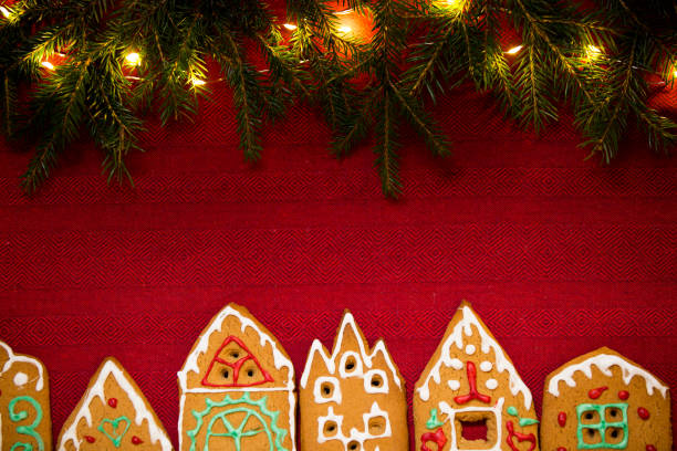 istock Red table cloth with town of cute gingerbread 1187615139