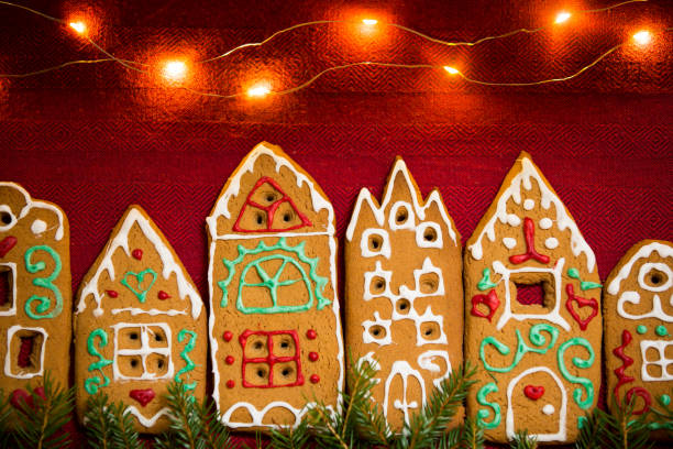 istock Red table cloth with town of cute gingerbread 1187615265