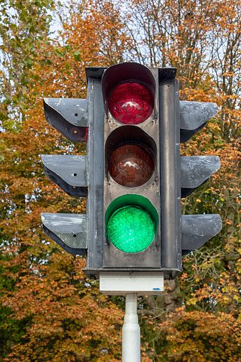 Vintage traffic light with a green light