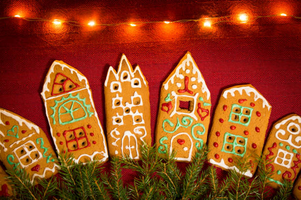 istock Red table cloth with town of cute gingerbread 1187615833