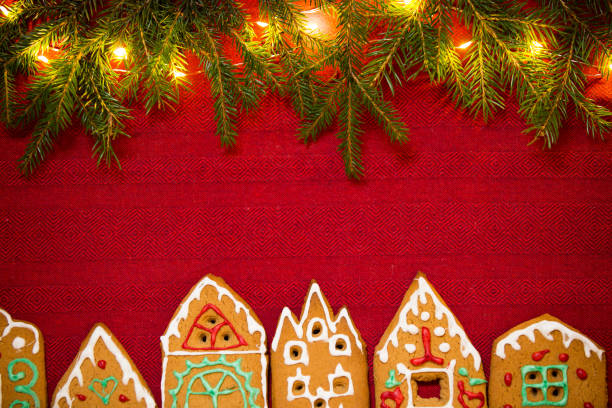 istock Red table cloth with town of cute gingerbread 1187616523