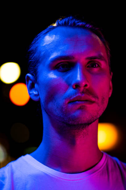 istock Modern red and blue light portrait of a young man 1187616884