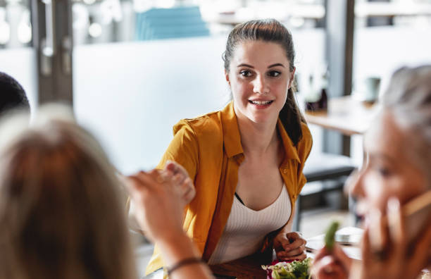 istock Business People Discussing at Lunch in a Cafeteria 1187616894