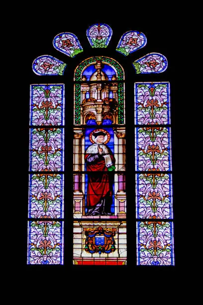 Interior stained glass shot of the basilica of Sainte-Anne-d'Auray, built from 1866 to 1872, in neo-Gothic style, the most important pilgrimage site in Brittany, at zoom 18/135, 1600 iso, f 5.6, 1/160 second