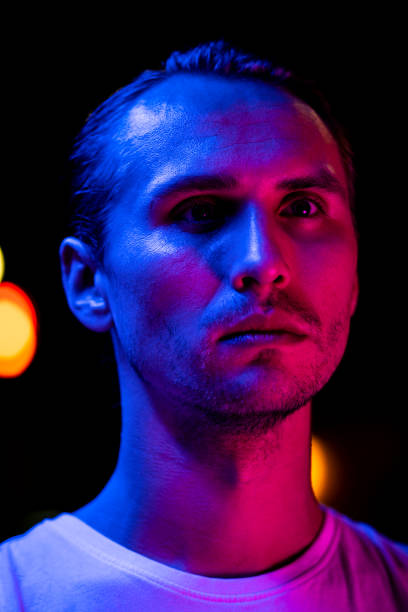 istock Modern red and blue light portrait of a young man 1187616940