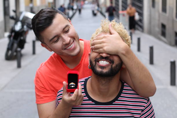 homosexual couple about to get engaged - flag rainbow gay pride flag gay man imagens e fotografias de stock