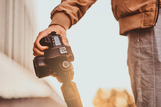 istock Man is carrying his digital photo camera 1187619794
