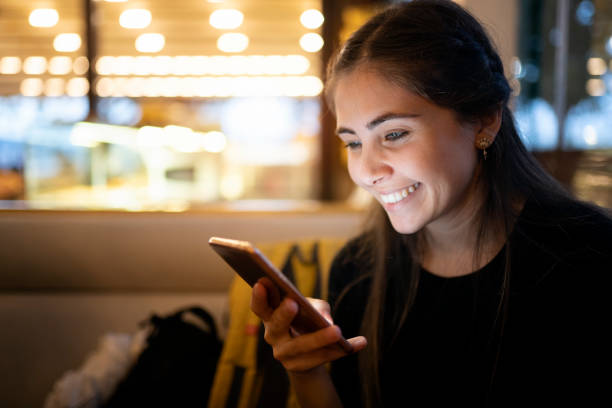 istock Young woman using smart phone 1187621897