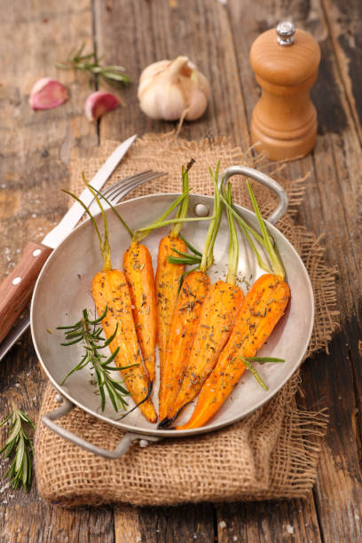istock grilled carrot with herb in cooking pan 1187625081