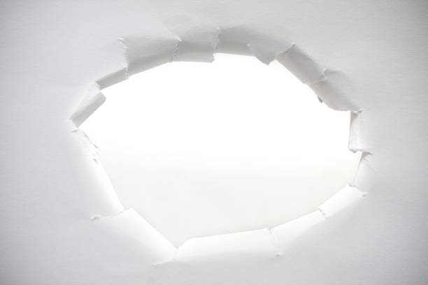 istock Torn paper hole background isolated on white 1187627324