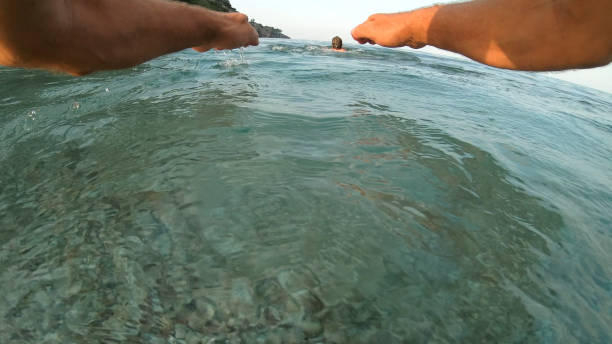 istock Young man swims out to sea 1187627731