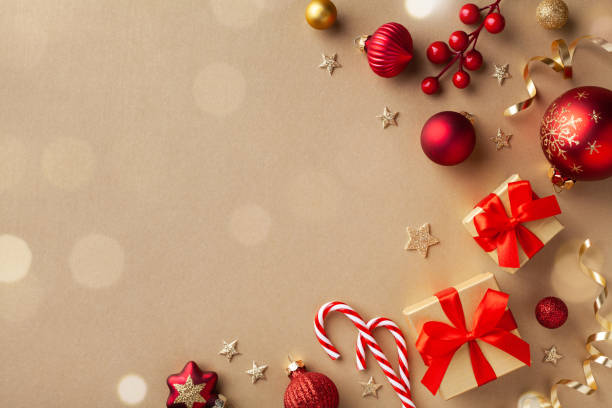 istock Christmas composition. Gift boxes, holiday decorations on golden background top view. Flat lay. 1187629115
