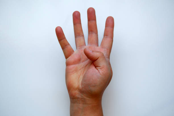 istock White Male Hand Shows Four 1187633669