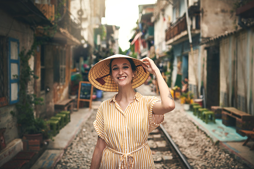 Shot of a young woman walking through the streets of Vietnam