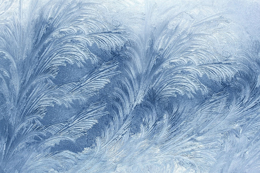 Frost drew an icy pattern on the window.Texture or background.
