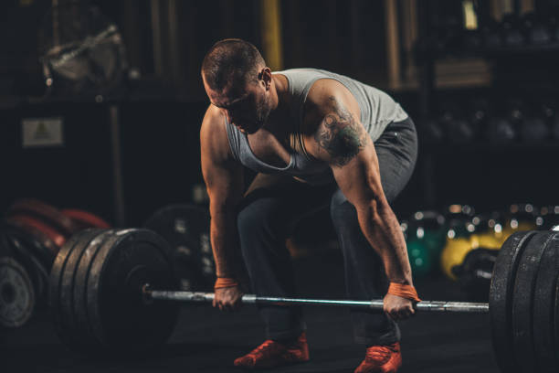 istock Man weightlifting in gym 1187636021