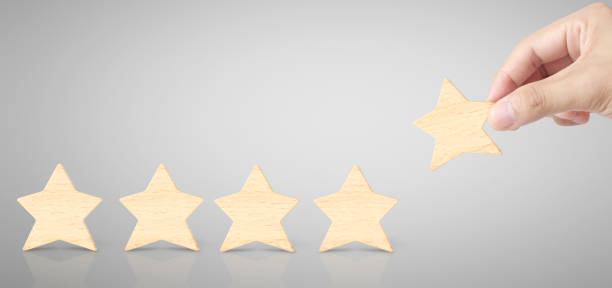 istock Hand of putting increase wood five star shape 1187637626