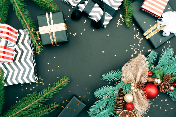 istock New Year flat lay with gifts on a black background. 1187640185