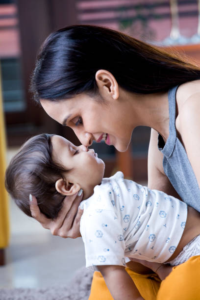 istock Mother holding sleeping baby boy 1187640582