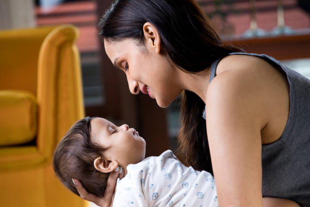 istock Mother holding sleeping baby boy 1187640714