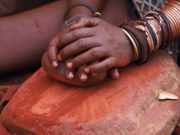 istock Namibian woman hands while working clay 1187641304
