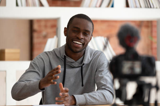istock Camera recording self-introduction of african guy talks about himself 1187643083