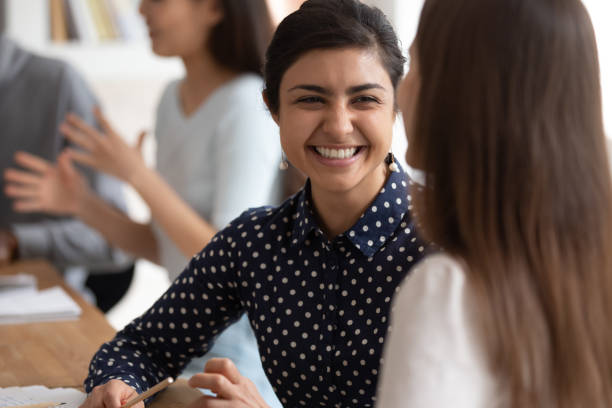 istock Girls students do common exercise task sitting at desk indoors 1187643096