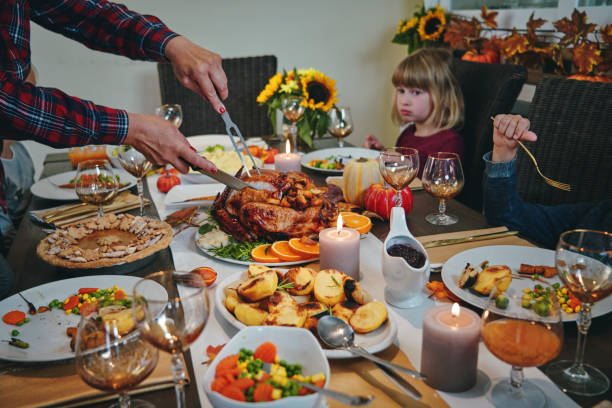 istock Family Having Traditional Holiday Stuffed Turkey Dinner 1187643162