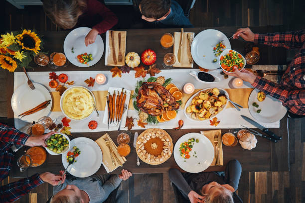 istock Family Having Traditional Holiday Stuffed Turkey Dinner 1187643164