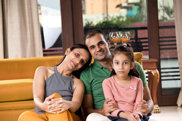 istock Happy Indian family at home 1187643531