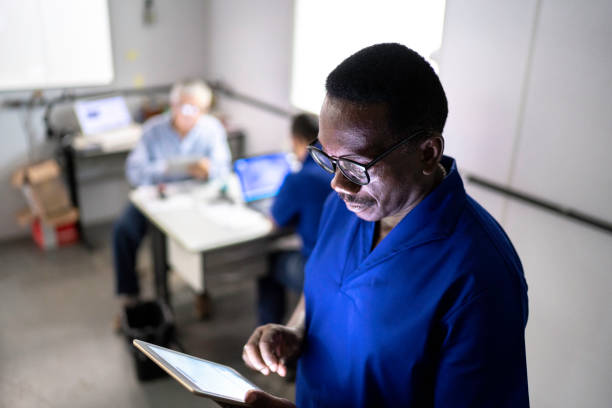 istock Mature employee using digital tablet in industry 1187643728