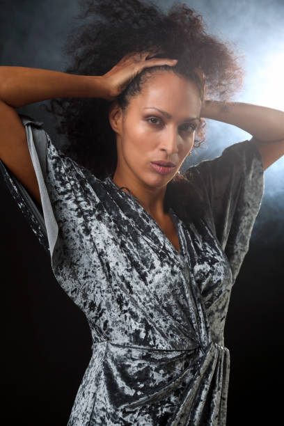 istock Mid adult woman backlit 1187643758