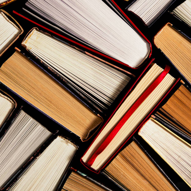 istock Lots of multi-colored books with multi-colored bookmarks close-up 1187645714