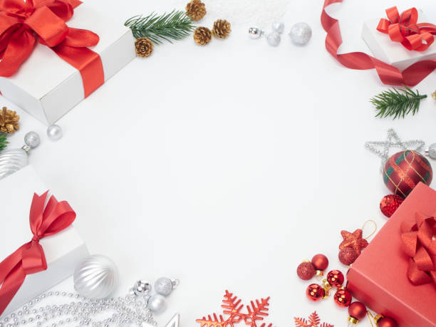 istock Christmas and New Year greeting card with composition festive decorations. Gift boxes, pine cones and Christmas balls on white background. 1187649187