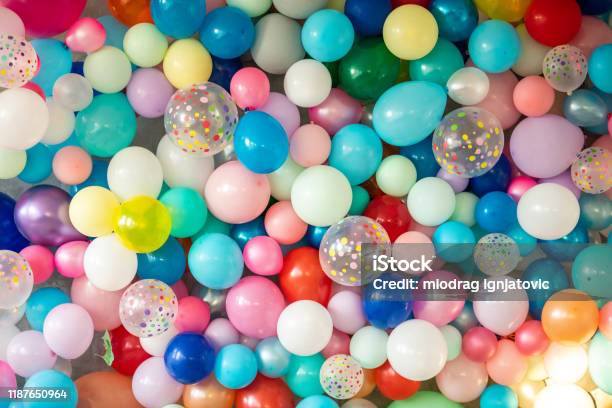Colorful Balloons On Wall Stock Photo - Download Image Now - Balloon, Birthday, Backgrounds