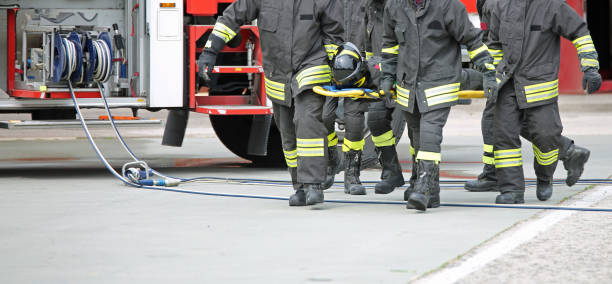 istock four firemen stretcher bearer after the road crash 1187656620