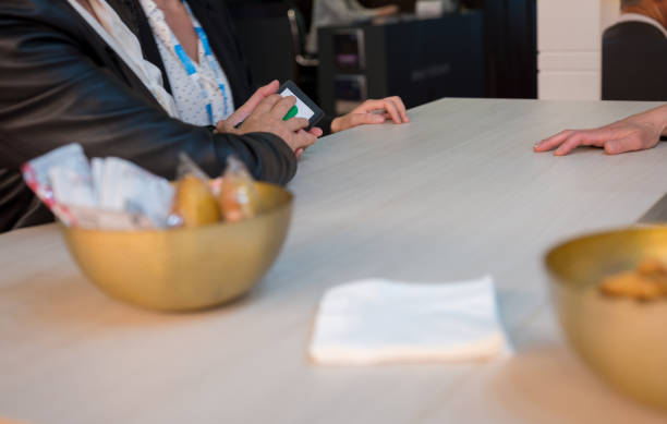 istock Businesswoman using phone during meeting 1187657265