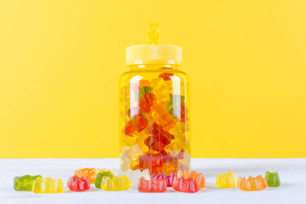 istock vitamins for children like jelly candy on yellow background 1187662544