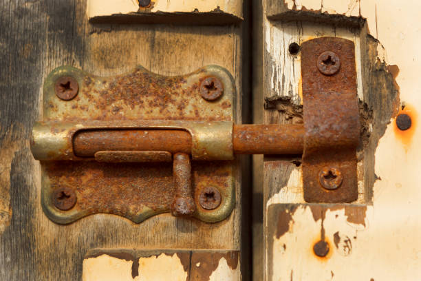 istock Closed rusty on an wooden door 1187665224