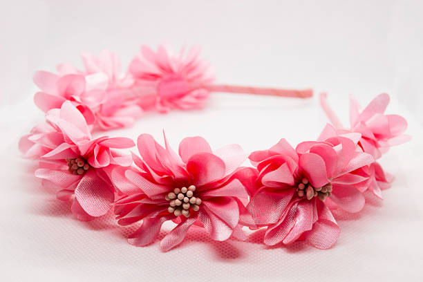 istock Baby hair accessory with pink flowers on white background 1187665272