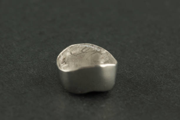 istock Dental  metal tooth crowns isolated 1187665614