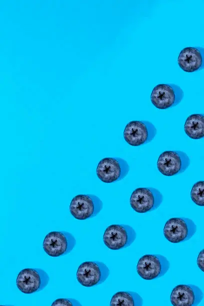 Photo of Blueberry Pattern on Blue Background