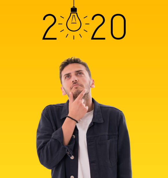 istock Young man pointing at checklist with 2020 goals 1187667074